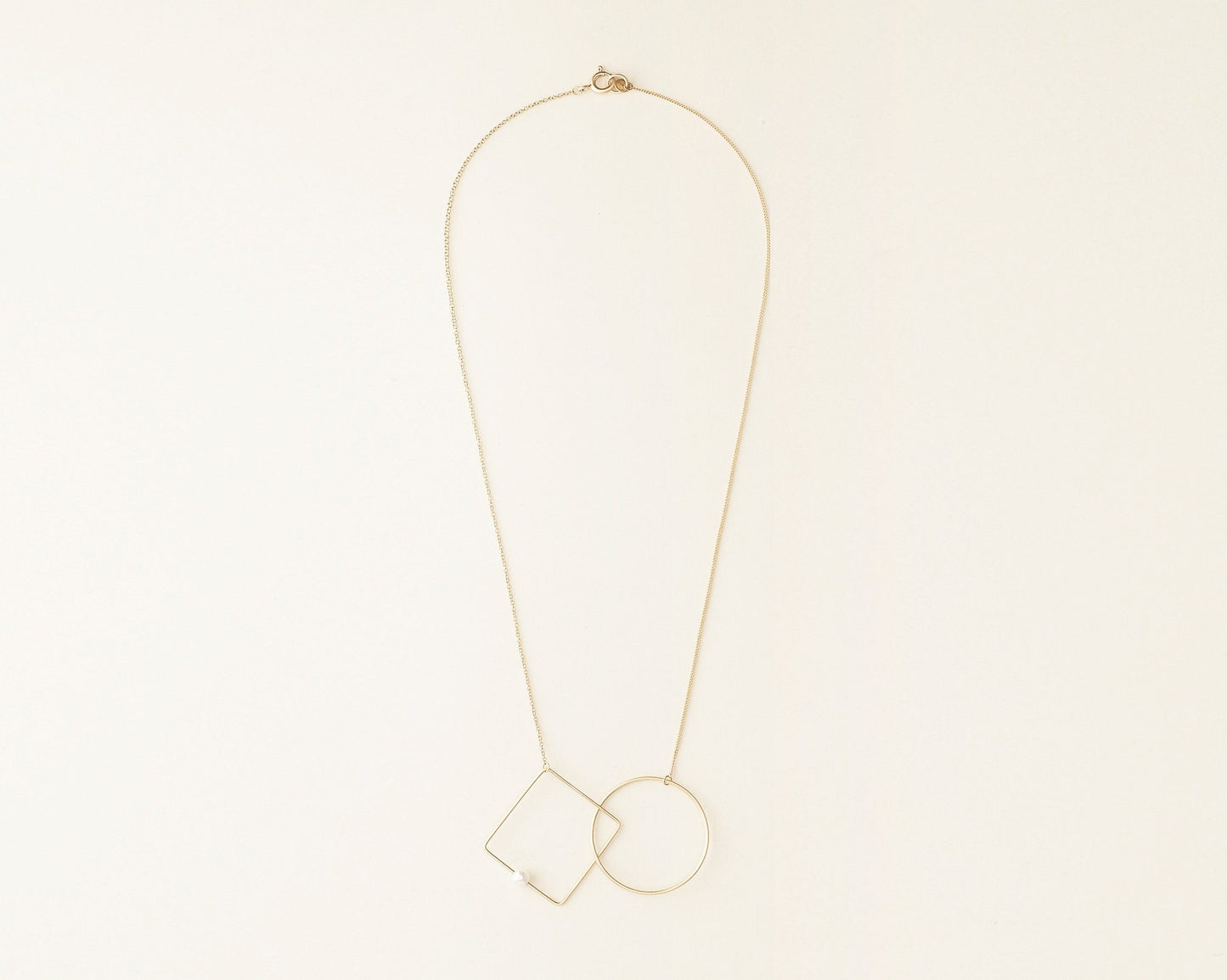 18KT yellow gold necklace with geometric elements and akoya pearl (diameter 4,5mm) - Cerchio Quadrato N
