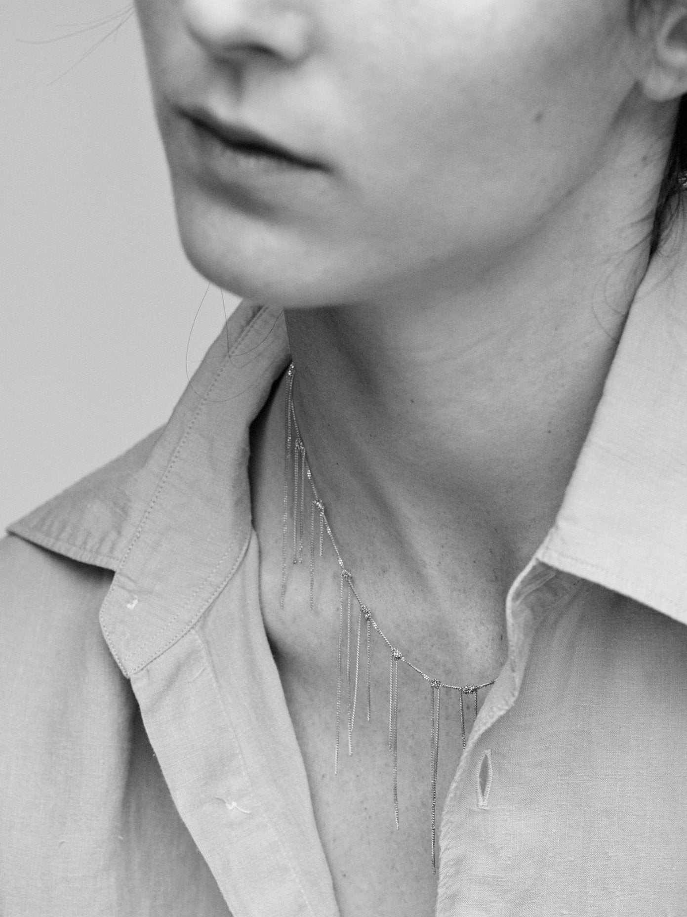 18KT yellow gold fringe necklace worn by a female neck - Fringe