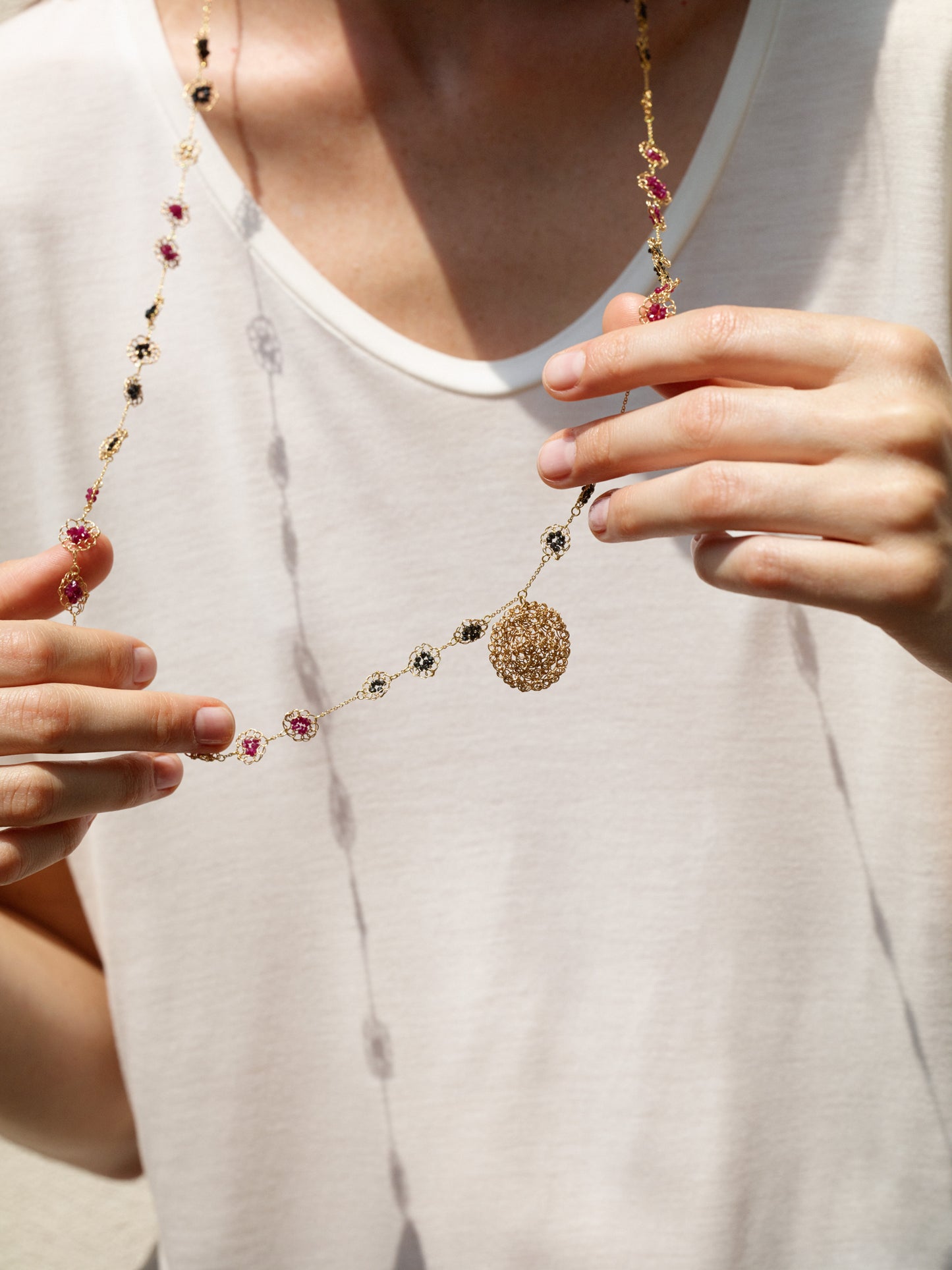 18KT yellow gold necklace with diamonds and rubies length 95 cm worn by female neck - Mosaico