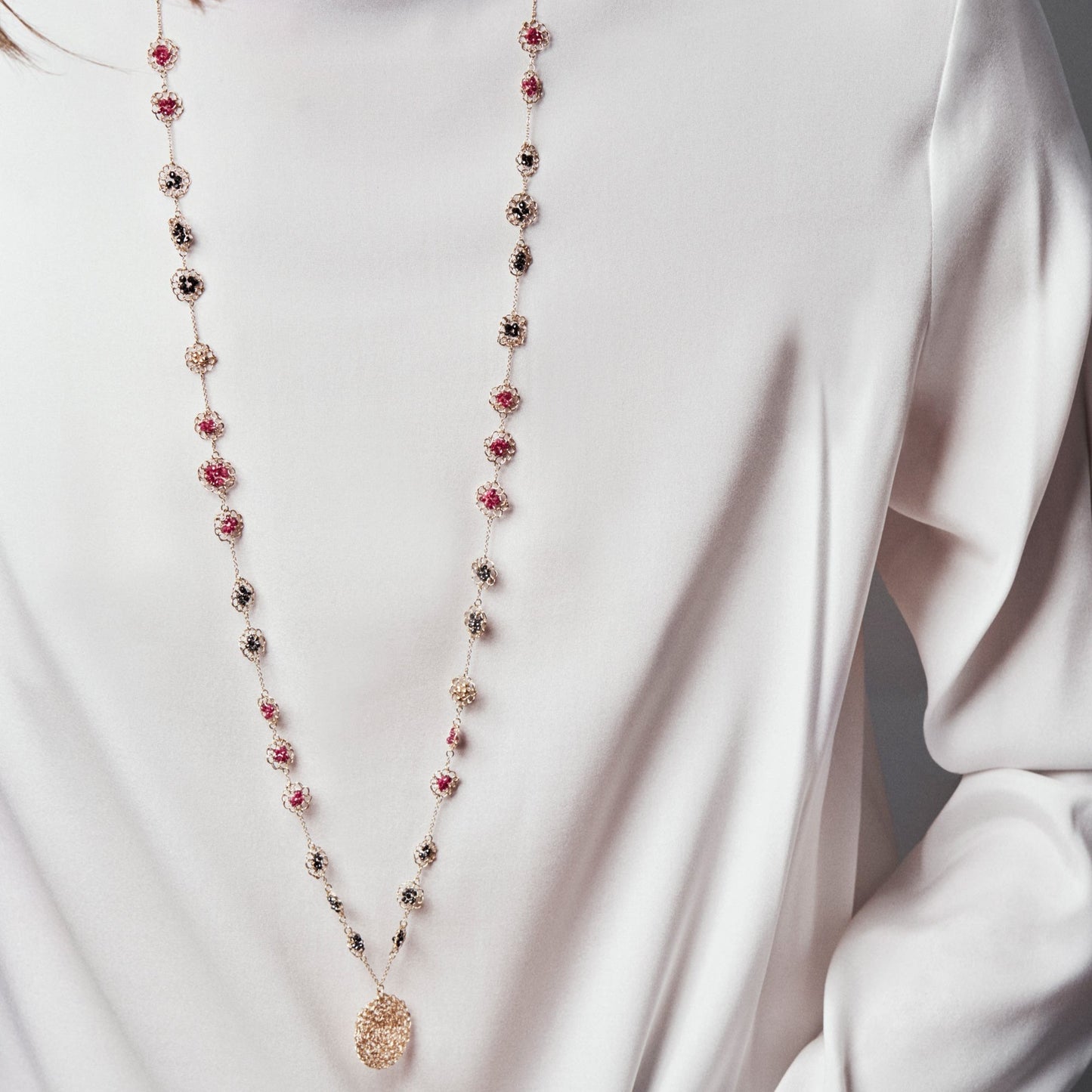 18KT yellow gold necklace with diamonds and rubies length 95 cm worn by female neck - Mosaico