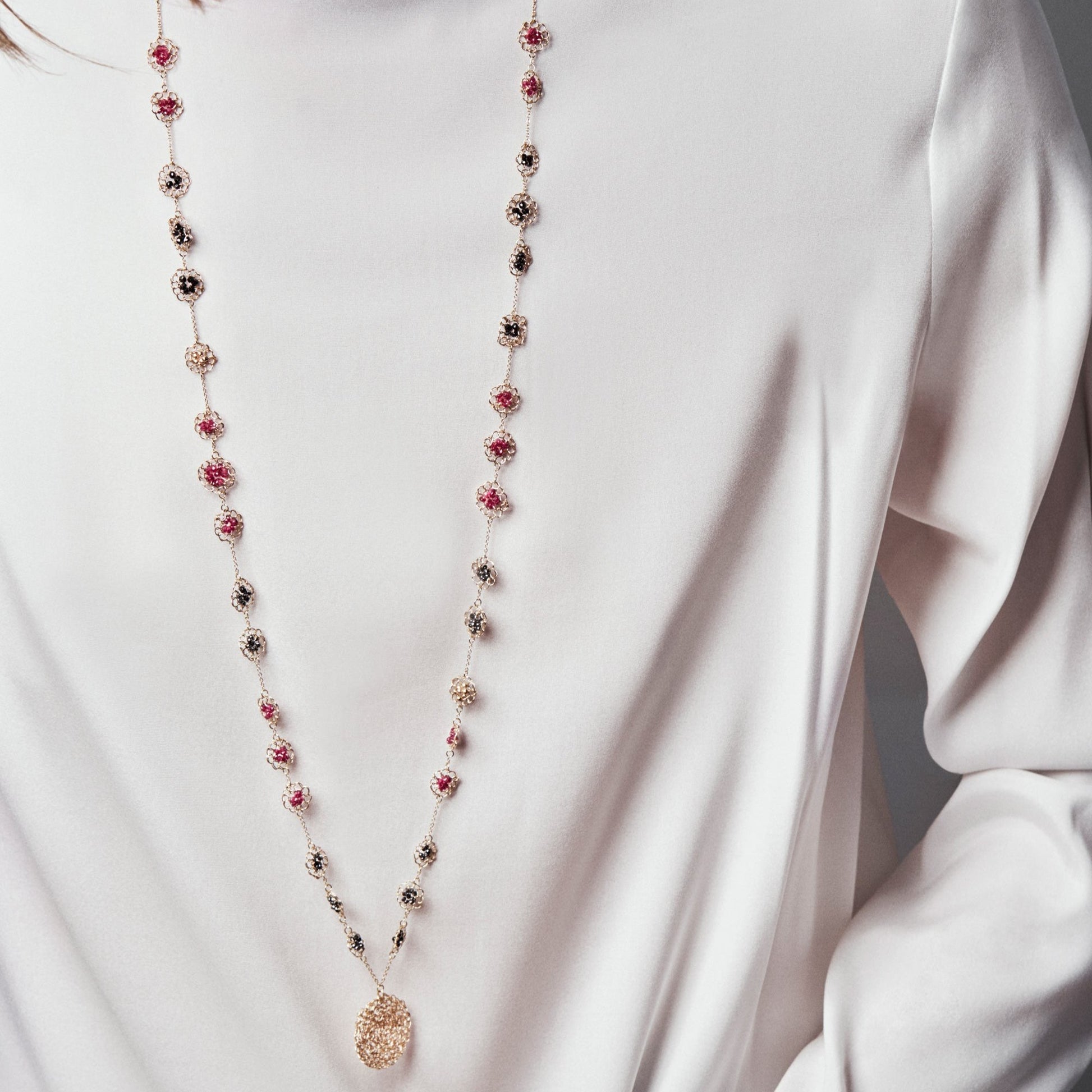 18KT yellow gold necklace with diamonds and rubies length 95 cm worn by female neck - Mosaico