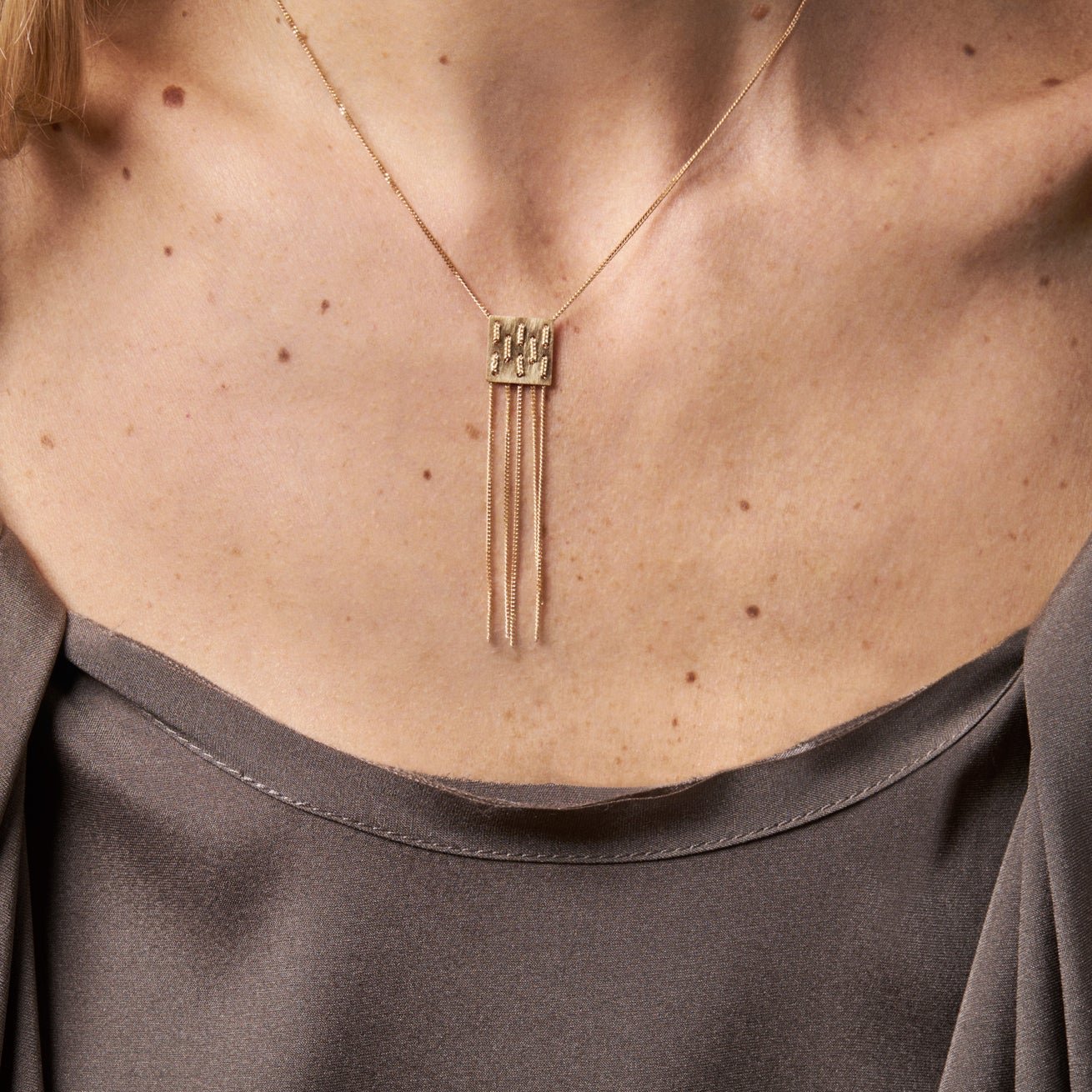 18KT yellow gold pendant necklace worn by a female neck - Waeve N