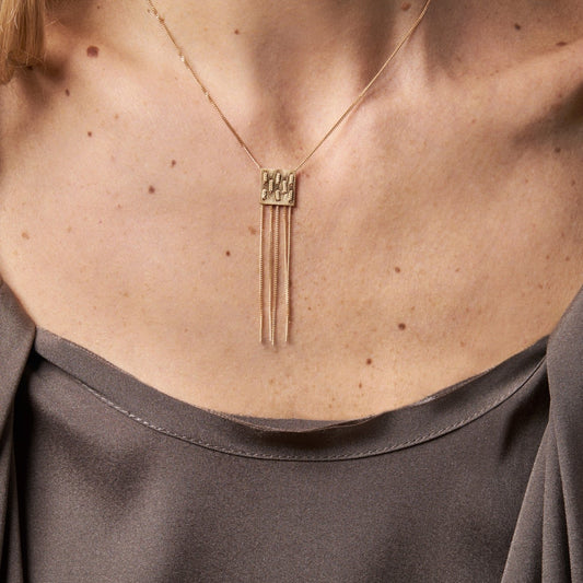 18KT yellow gold pendant necklace worn by a female neck - Waeve N