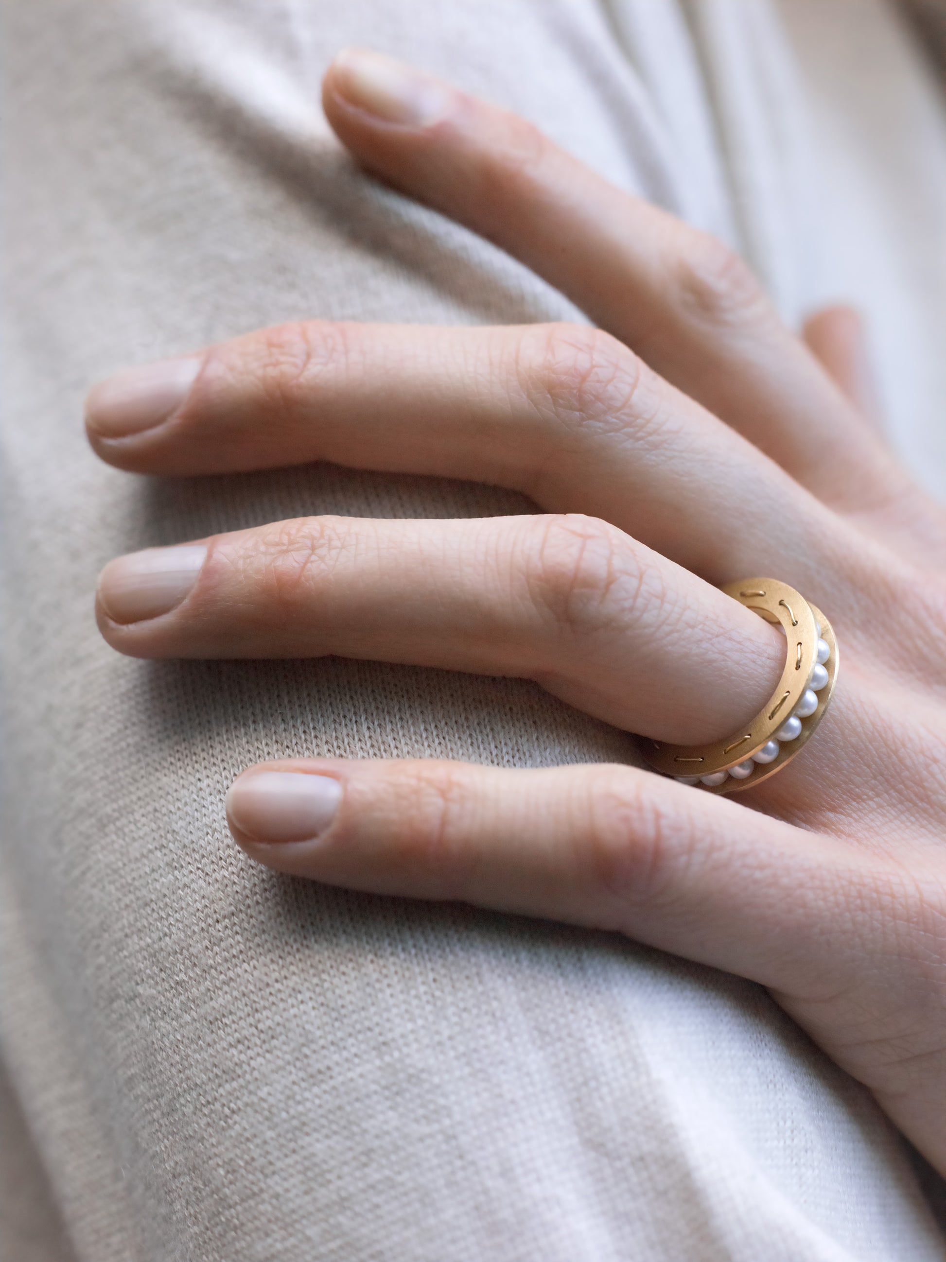 18KT yellow gold ring with freshwater pearls worn by female hand - Sfere