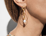 18KT yellow gold hanging earrings with keshi pearls worn by a female ear  - Insieme 5E