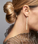 18KT yellow gold pendant earrings worn by a female ear - Progressione 12